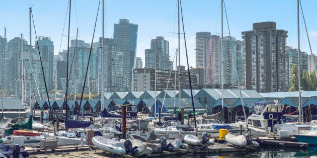 Condo and apartment towers in Vancouver's West End are seen from a marina. The city's housing market has recorded its slowest year since 2000.
