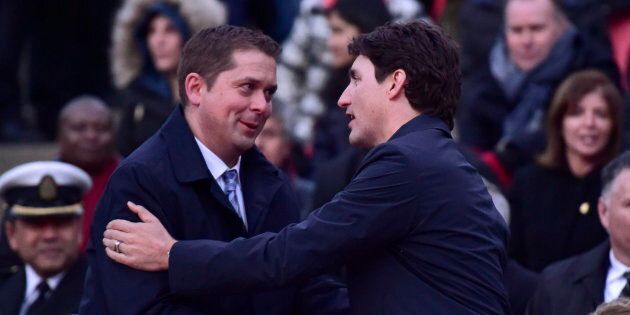 Conservative Leader Andrew Scheer and Prime Minister Justin Trudeau greet each other in Toronto on April 29, 2018.
