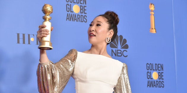 Sandra Oh admires the Golden Globe she won while hosting the 76th Annual Golden Globe Awards on January 6, 2019 in Beverly Hills, California.