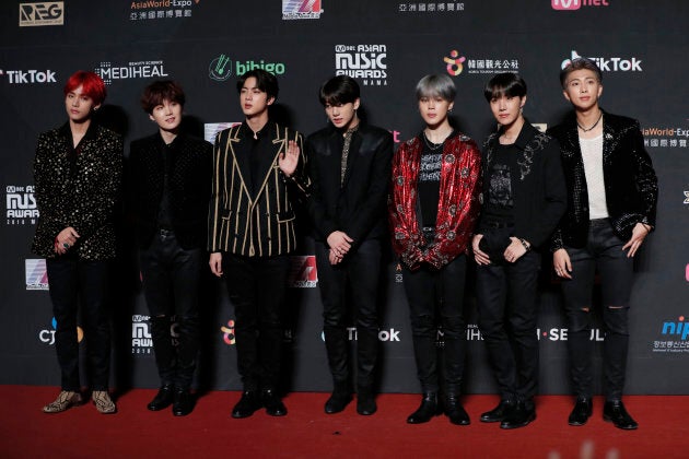 Members of South Korean music band BTS pose for photos on the red carpet of the Mnet Asian Music Awards (MAMA) in Hong Kong.
