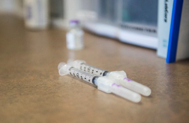 Needles sit on the counter waiting to be prepared to administer the annual flu vaccination at Crawford Kids Clinic in Aurora, Colorado.