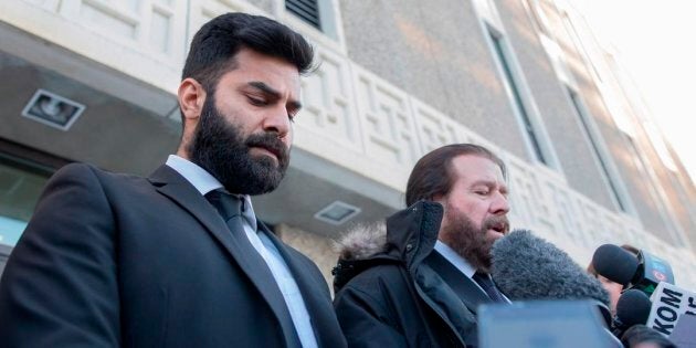 Jaskirat Singh Sidhu leaves provincial court with his lawyer Mark Brayford in Melfort, Sask. on Tuesday.