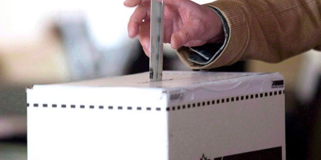 A voter casts a ballot in the 2011 federal election in Toronto on May 2, 2011.