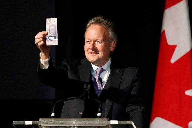 Bank of Canada Governor Stephen Poloz shows off Canada's new $10 banknote at a launch at the Canadian Museum For Human Rights in Winnipeg on Nov. 19, 2018.