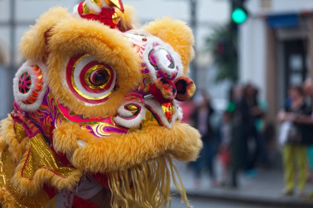 A performer in a traditional lion dance costume for Chinese New Year.