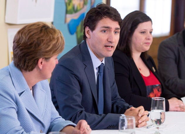 Lac-Mégantic mayor Julie Morin, right, with Prime Minister Justin Trudeau and International Development Minister Marie-Claude Bibeau during a round table on regional development on May 11, 2018 in Lac-Mégantic, Que.