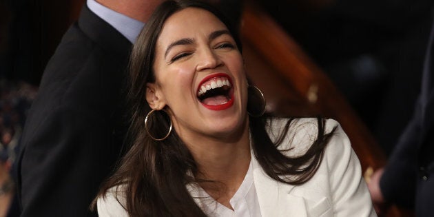 Alexandria Ocasio-Cortez (D-NY) talks to fellow members of Congress during the first session of the 116th Congress at the U.S. Capitol Jan. 03, 2019 in Washington, D.C.