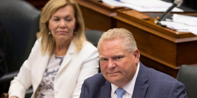 Ontario Premier Doug Ford sits next to Health Minister Christine Elliott during Question Period at Queen's Park, in Toronto on Tuesday, July 31, 2018.