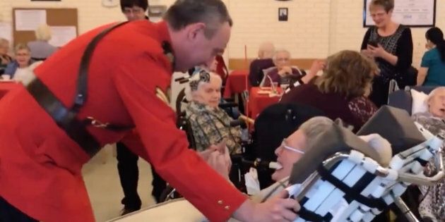 Cpl. Daryl Chernoff takes 100-year-old Elsie Shepherd for a glide around the dance floor at her birthday party.