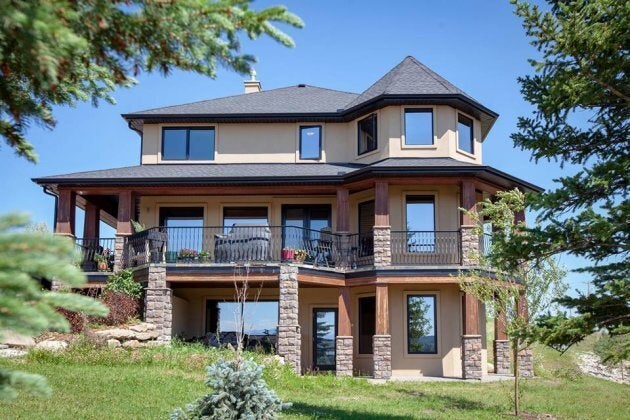 The rural home features a walk-out basement and views of the Canadian Rockies.