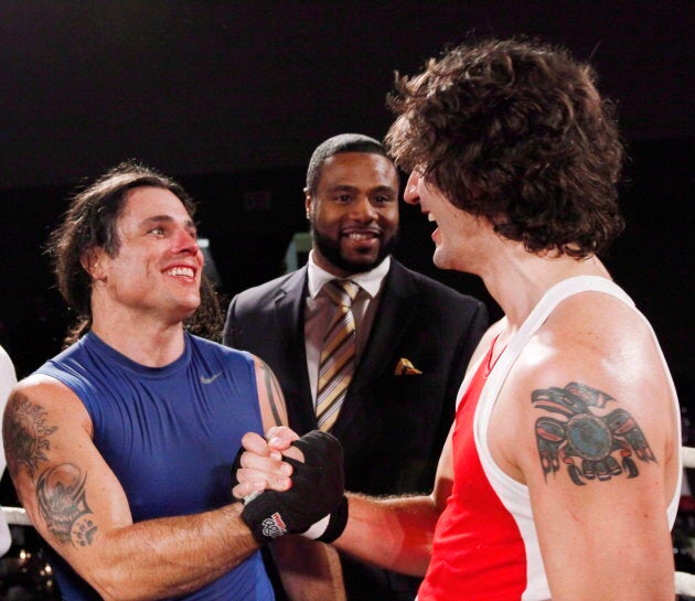 Patrick Brazeau congratulates Justin Trudeau after their charity boxing match for cancer research on March 31, 2012 in Ottawa.