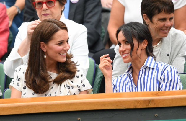 Kate Middleton and Meghan Markle at the Wimbledon Tennis Championships at the All England Lawn Tennis and Croquet Club on July 14, 2018 in London.