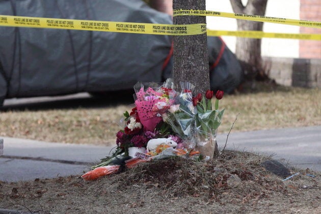 Flowers are seen outside a home in Ajax, Ont. on March 15, 2018 where Krassimira Pejcinovski, 39, her son Roy Pejcinovski, 15, and daughter Venellia Pejcinovski, 13, were killed. Krassmira's former partner, Cory Fenn, was charged with three counts of second-degree murder.