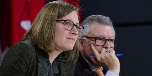 Democratic Institutions Minister Karina Gould attend a press conference with Public Safety Minister Ralph Goodale in Ottawa on Jan. 30, 2019.