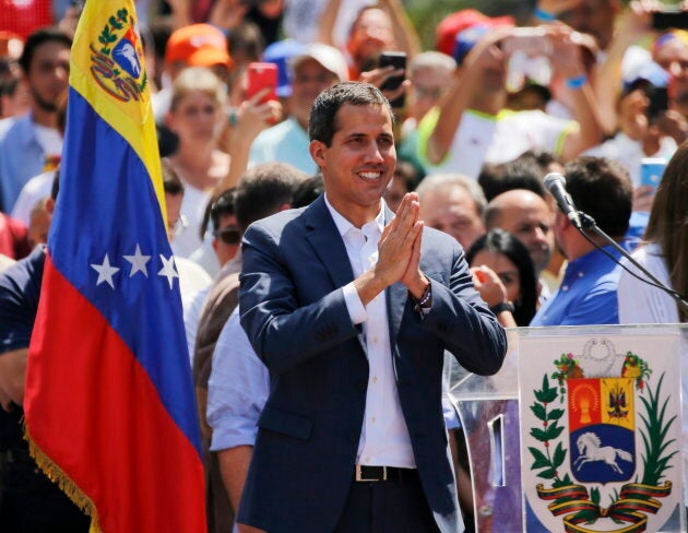 Venezuelan opposition leader Juan Guaido, who has declared himself the interim president of Venezuela, greets supporters as he arrives at a nationwide demonstration demanding the resignation of President Nicolas Maduro, in Caracas, Venezuela on Feb. 2, 2019.