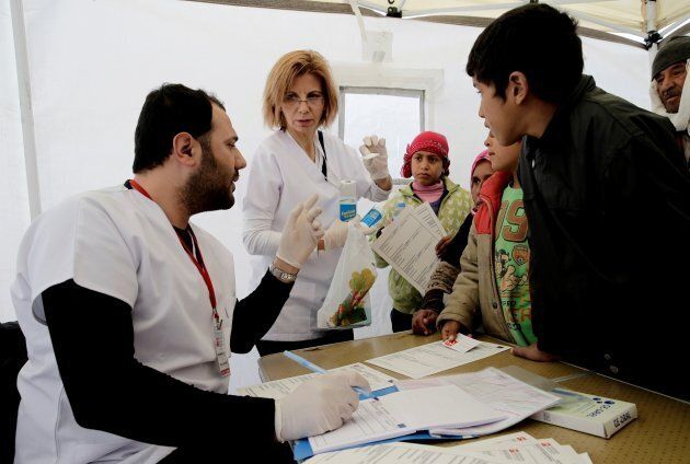Syrian refugees wait to be examined by Doctors WorldWide Turkey at a refugee camp in the Torbali district of Izmir, Turkey on Dec. 21, 2016.