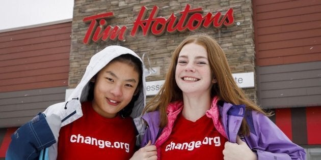 Mya Chau, left, 12, and Eve Helman, 12, are petitioning Tim Hortons to make the roll up the rim campaign more environmentally friendly.