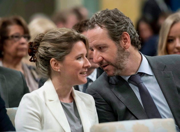 Gerald Butts, speaks with Katie Telford before a swearing in ceremony at Rideau Hall in Ottawa on July 18, 2018.