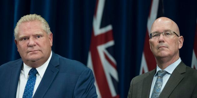 Ontario Premier Doug Ford and Minister of Municipal Affairs and Housing Steve Clark attend a press conference on Sept. 10, 2018.