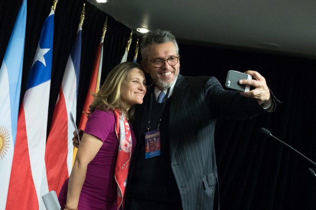 Orlando Viera-Blanco, Venezuela's intern leader's representative in Canada, takes a selfie with Canadian Minister of Foreign Affairs Chrystia Freeland after the press conference for the 10th Lima Group meeting in Ottawa on Feb. 4, 2019.