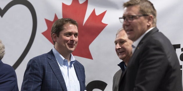 Conservative Leader Andrew Scheer, New Brunswick Premier Blaine Higgs, and Saskatchewan Premier Scott Moe, from left, at the conclusion of a pro-pipeline rally at IJACK Technologies Inc. near Moosomin, Saskatchewan on Feb. 16, 2019.