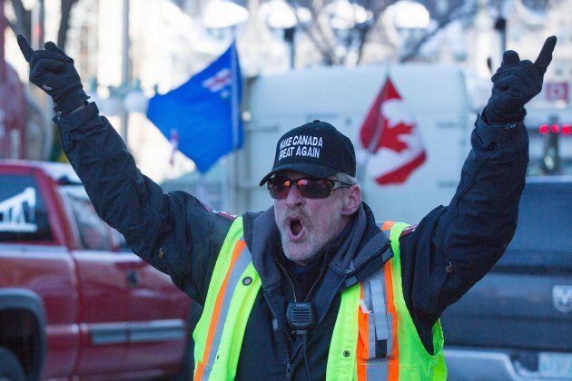 A man wears a 'Make Canada Great Again' hat during the Convoy for Canada protest on Parliament Hill in Ottawa on Feb. 19, 2019.