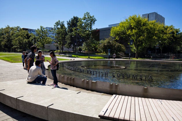 A few students seen in front of a fountain at the University of British Columbia in Vancouver.