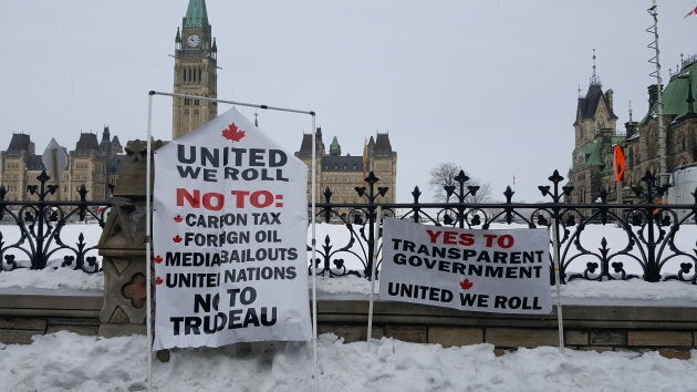 Many signs were displayed as part of the "United We Roll" convoy rally on Parliament Hill in Ottawa on Feb. 20, 2019.