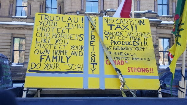 A sign is affixed onto a truck at the "United We Roll" convoy.