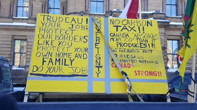 A sign is affixed onto a truck at the "United We Roll" convoy.