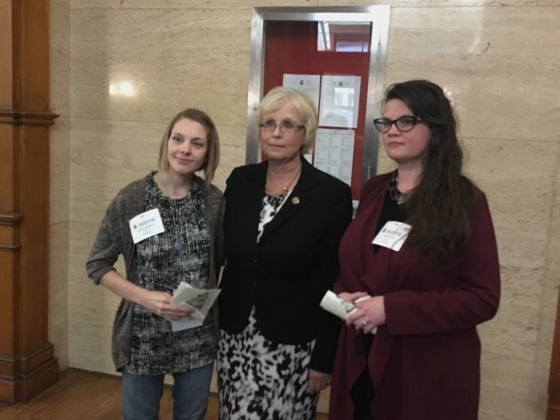 Mothers Sarah Farrants and Brandi Tapp pose with NDP MPP Peggy Sattler at Queen's Park in Toronto on Feb. 21, 2019.