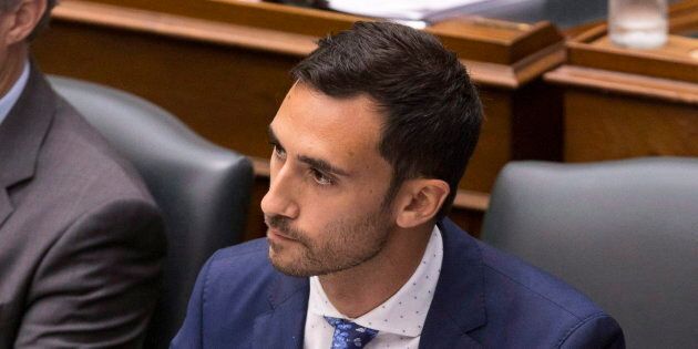 Progressive Conservative MPP Stephen Lecce, right, attends question period at the Ontario legislature in Toronto on July 31, 2018.
