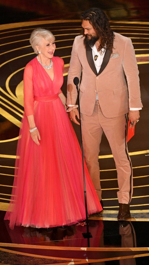 Helen Mirren and Jason Momoa onstage at the Oscars.