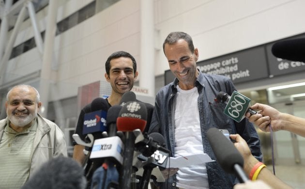 Mahmoud Loubani (left) beams after his son Tarek Loubani (centre) and John Greyson returned to Canada...