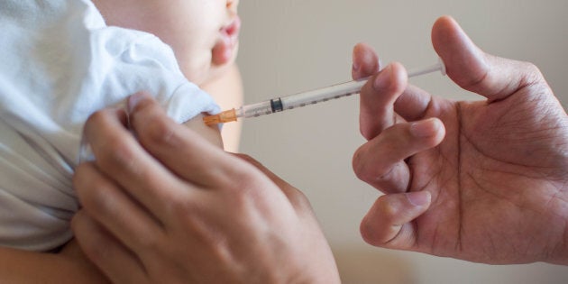 A doctor injects a vaccine to into a baby boy. Vaccines do not cause autism, and are are critical to stopping the spread of disease, say public health officials across Canada.