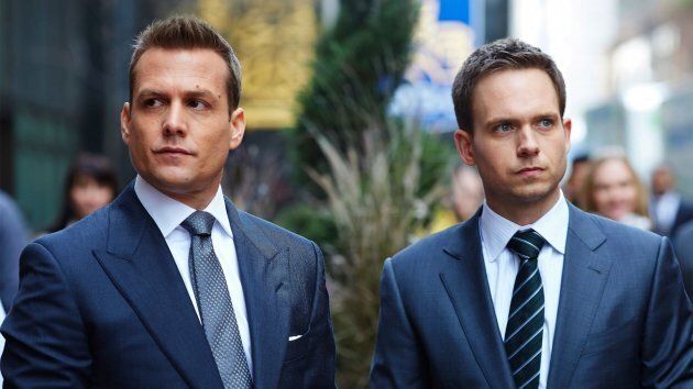 Men in "Suits."