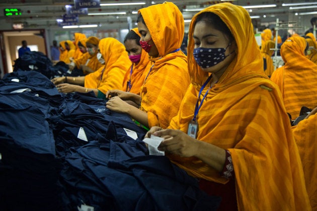 Workers at a garment factory work at MB Knit garment factory in Narayanganj, near Dhaka, Bangladesh.