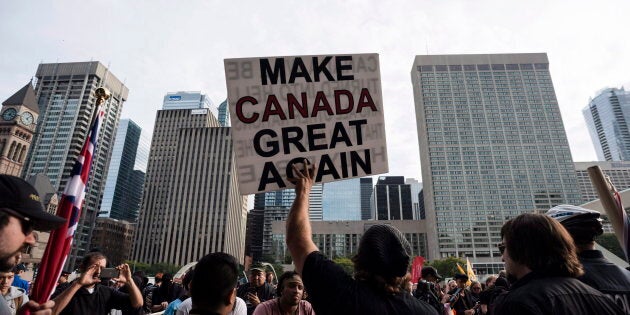 Far-right and nationalist groups, including the Northern Guard, Proud Boys, and individuals wearing Soldiers of Odin patches, gathered to protest the government's lawsuit settlement with Canadian torture victim Omar Khadr in Toronto on Oct. 21, 2017.