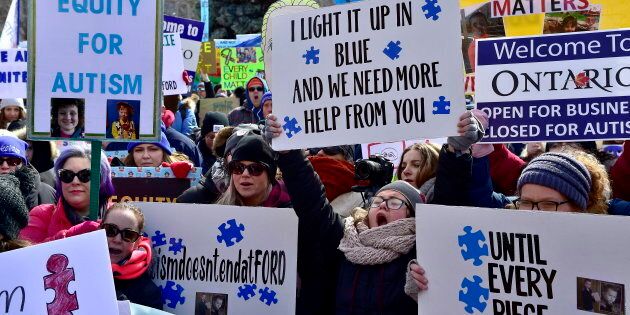 Hundreds of parents and supporters gather outside Queen's Park in Toronto on March 7, 2019, to protest the Ontario government's changes to its autism program.
