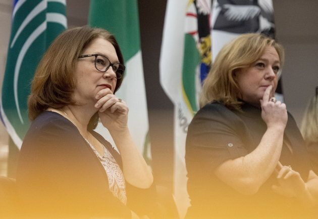 Liberal MP Jane Philpott and Ontario's Children, Community and Social Services Minister Lisa MacLeod listen during an International Women's Day event at Ottawa City Hall on March 8, 2019.