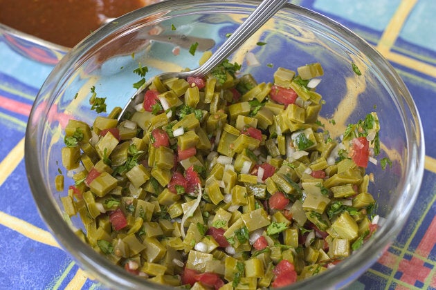 A traditional Mexican salad bowl of nopales with tomatoes and onions.