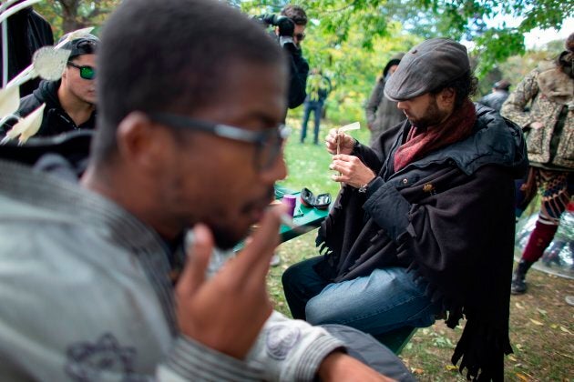 A man rolls a marijuana cigarette during a legalization party in Toronto on October 17, 2018 — the day nearly a century of marijuana prohibition came to an end.