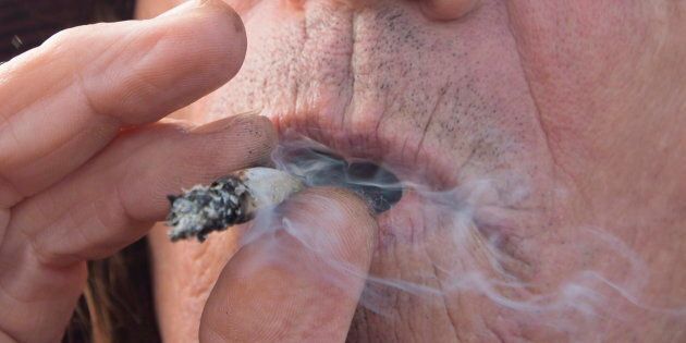 A man smokes a marijuana joint in Kamloops, B.C. on Oct. 17, 2018.
