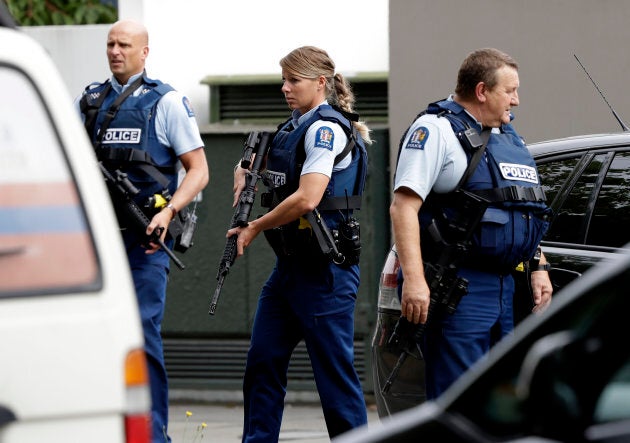 Armed police patrol outside a mosque in central Christchurch, New Zealand on Friday.