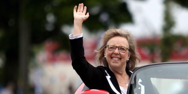 Green Party Leader Elizabeth May waves to the crowd as she rides in a sports car during the annual Victoria Day Parade in Victoria, B.C., on May 21, 2018.