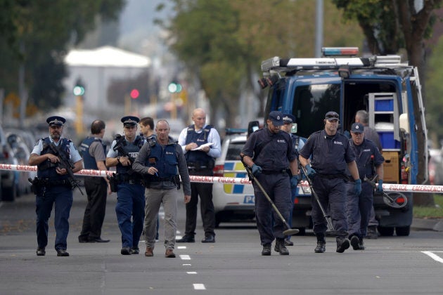 Police officers search the area near the Masjid Al Noor mosque, site of one of the mass shootings at two mosques in Christchurch, New Zealand on Saturday.