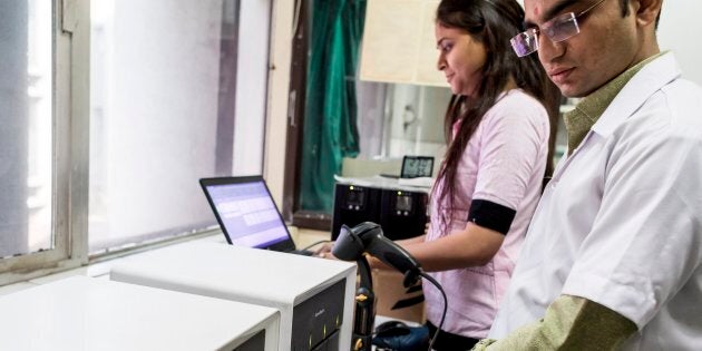 Using a GeneXpert machine in a CBNAAT laboratory at the Surat Municipal Institute of Medical Education & Research (SMIMER), Surat. The Genexpert test detects the presence of TB bacteria DNA in a patient sample.