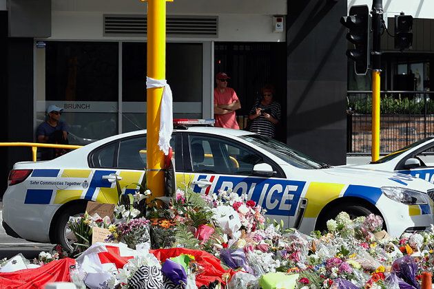 Residents pay respect by placing flowers for the victims of the mosques attacks in Christchurch on Saturday.