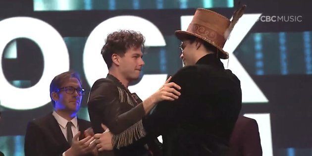 Arkells singer Max Kerman embraces musician Jeremy Dutcher at the Junos gala dinner and awards on March 16, 2019.