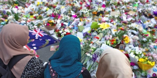 A group of women pay tribute to the victims of the mosque attack at the botanic garden memorial, in Christchurch, New Zealand on March 19, 2019.